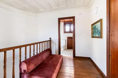 a living room with a couch on a staircase at Historical Greco-Ottoman Pavilion near Tram in Fatih in Istanbul