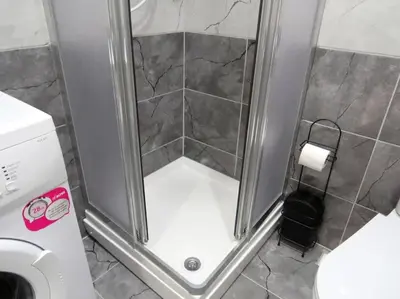 a shower with a glass door in a bathroom at Istanberry - Royal Apartments in Istanbul