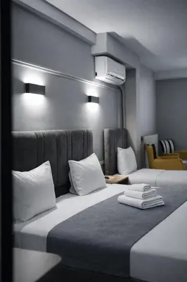 a hotel room with two beds with white pillows at Olen Uskudar Hotel in Istanbul