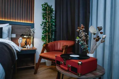 a bedroom with a red suitcase and a chair at Elite Marmara Boutique Hotel Sultanahmet in Istanbul