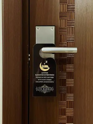 a sign on a door with a sign on it at Elite Marmara Boutique Hotel Sultanahmet in Istanbul