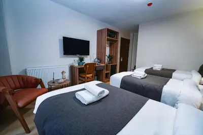 a hotel room with two beds and a television at Elite Marmara Boutique Hotel Sultanahmet in Istanbul