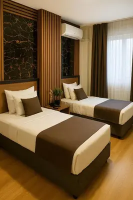 a hotel room with two beds in a room at Elite Marmara Boutique Hotel Sultanahmet in Istanbul
