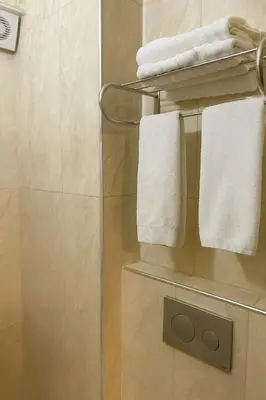 a towel rack in a bathroom with white towels at Elite Marmara Boutique Hotel Sultanahmet in Istanbul
