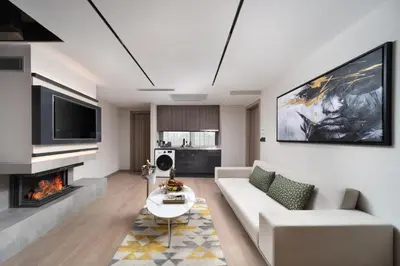 a living room with a couch and a fireplace at Nish Palace Beşiktaş in Istanbul