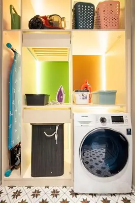 a kitchen with a washing machine in a cabinet at sevim suites With a sea view in nişantaşı in Istanbul