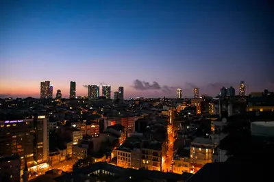 a view of a city at night at sevim suites With a sea view in nişantaşı in Istanbul