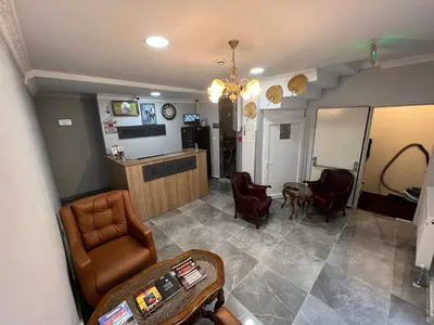a waiting room with chairs and a barber shop at MİRHAN HOTEL in Istanbul