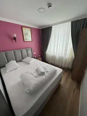a bedroom with a bed with two towels on it at MİRHAN HOTEL in Istanbul
