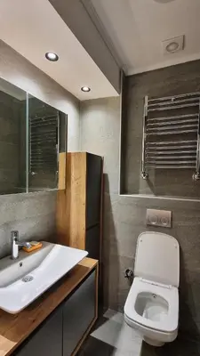 a bathroom with a white toilet and a sink at Tam Merkezde Yepyeni Bir Daire in Istanbul