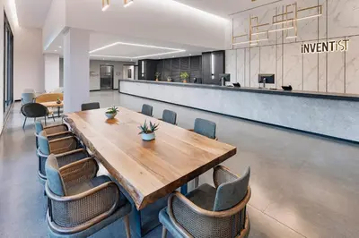 a conference room with a wooden table and chairs at INVENTIST Hotel Sports Academy Istanbul in Istanbul