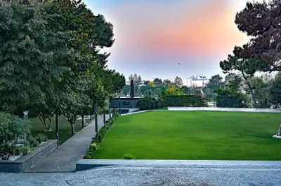 a park with a green lawn and trees at Denizatı Plus Hotel in Istanbul
