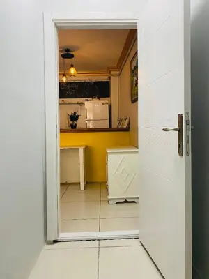 an open door to a kitchen with yellow walls at Stylish Hotel Old City in Istanbul