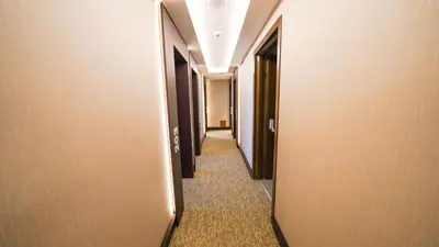 a hallway of a hotel with a long corridor at Bellezza Hotel in Istanbul