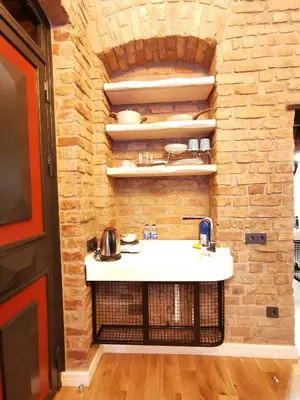a bathroom with a sink and a brick wall at Casa 1899 in Istanbul