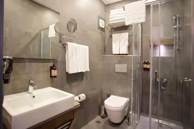 a bathroom with a sink and a toilet and a shower at Days Inn by Wyndham Istanbul Arnavutkoy in Istanbul