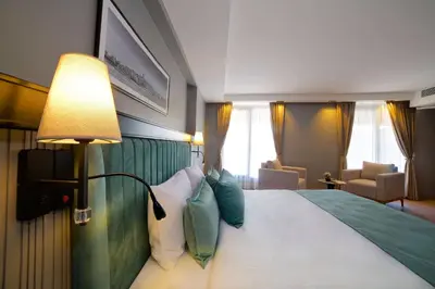 a hotel room with a large bed with pillows at Days Inn by Wyndham Istanbul Arnavutkoy in Istanbul