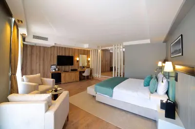 a bedroom with a bed and a living room at Days Inn by Wyndham Istanbul Arnavutkoy in Istanbul