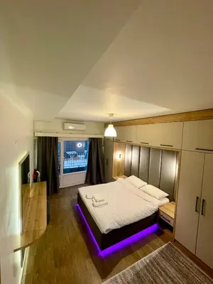 a bedroom with a bed with a purple lighting at Unique/Cosy flat near Taksim/Nişantaşı in Istanbul
