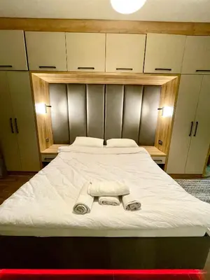 a bedroom with a bed with two towels on it at Unique/Cosy flat near Taksim/Nişantaşı in Istanbul
