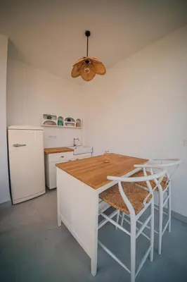 a kitchen with a table and chairs and a ceiling at Terra House Sapanca in Sapanca
