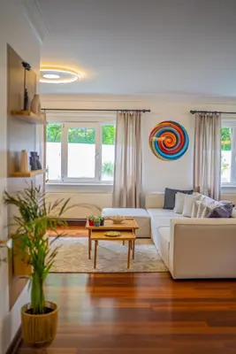 a living room with a white couch and a table at Terra House Sapanca in Sapanca