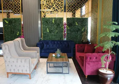 a living room with two couches and a table at Aram Otel Business & Luxury in Istanbul