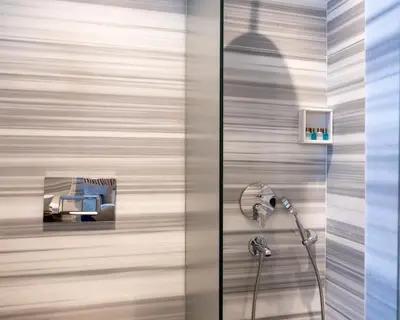 a shower with a shower head in a bathroom at Hotel Balo in Istanbul