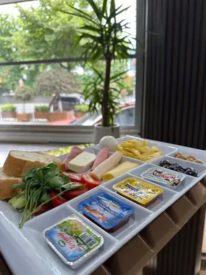 a tray with different types of food on a table at Garden Room Suit Hotel in Istanbul