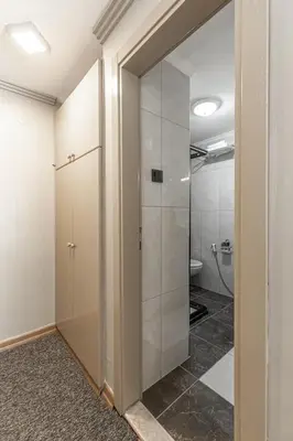 a bathroom with a shower and a glass door at BURSA LOYAL CiTY HOTEL in Bursa