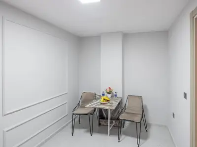 a dining room with a table and two chairs at The Red Tent Suite 23 in Istanbul