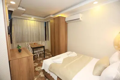 a hotel room with a bed and a table at IMMORTELLE HOTEL lord sophiha in Istanbul