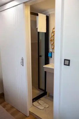 a bathroom with a shower and a sink at Blue Zerzevan Konak Hotel in Istanbul