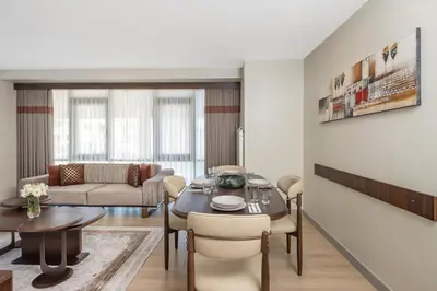 a living room with a table and a couch at Mayar Residence Hotel in Istanbul