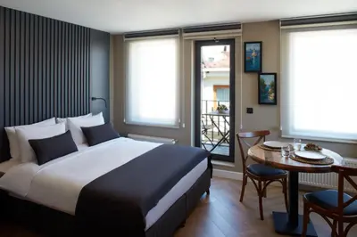 a hotel room with a bed and a table with a table at CASA GALATA 35 in Istanbul