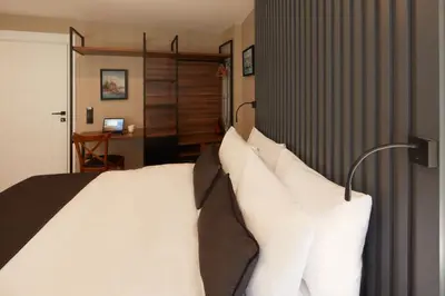 a bedroom with a bed with white pillows at CASA GALATA 35 in Istanbul