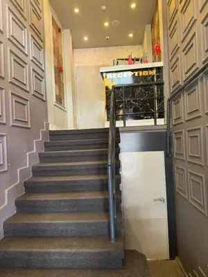 a set of stairs in a building with a door at Fidan City Hotel in Istanbul