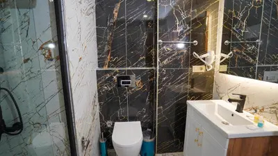 a bathroom with a toilet and a sink at Fidan City Hotel in Istanbul