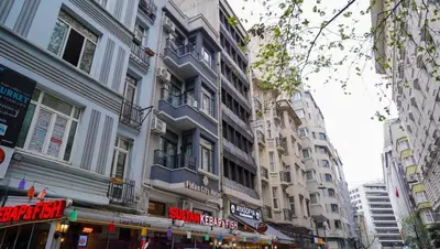 a group of tall buildings on a city street at Fidan City Hotel in Istanbul