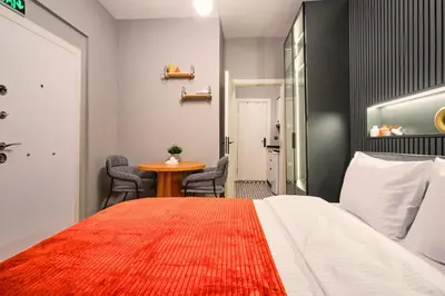 a hotel room with a bed and a table at TAKS-INN Hotel in Istanbul