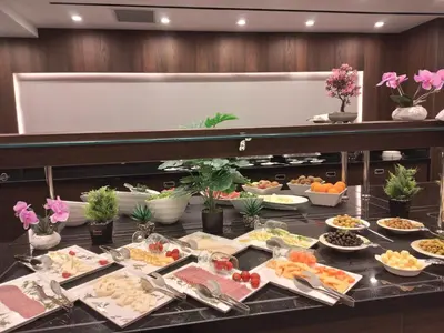a buffet with many different types of food on a table at Ramada by Wyndham Istanbul Umraniye in Istanbul