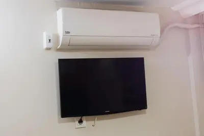 a television and a printer on a wall at Fidelya Boutique Hotel in Sultanahmet