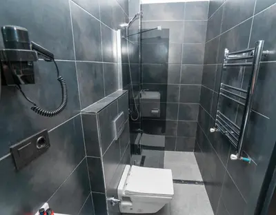a bathroom with a toilet and a shower at Center Suite in Istanbul
