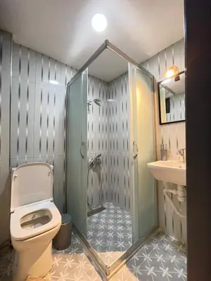 a bathroom with a toilet and a shower and a sink at La Perato in Istanbul