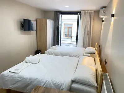 a hospital room with two beds and a window at La Perato in Istanbul