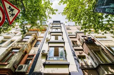 a tall building in a city at MITANI SUITES in Istanbul