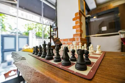 a chess board with chess pieces on a table at MITANI SUITES in Istanbul