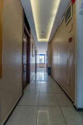 an empty hallway in an office building with a hallway at OTEL ÜMIT İSTANBUL in Istanbul