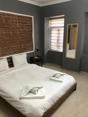 a bedroom with a large bed with two towels on it at Kilit no 1 in Istanbul