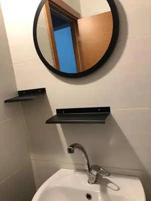 a bathroom with a sink and a mirror on the wall at Kilit no 1 in Istanbul